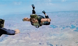 A Man And A Woman Are Fighting Each Other In A Movie . GIF