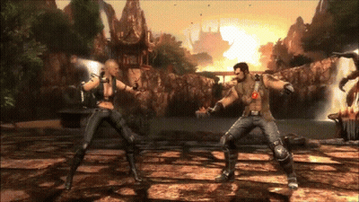 A Man And A Woman Are Fighting In A Video Game With A Waterfall In The Background GIF