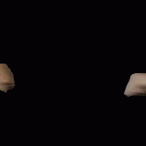 A Man And A Woman Are Giving Each Other A Fist Bump Against A Black Background GIF