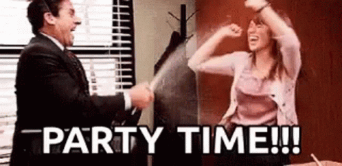 A Man And A Woman Are Having A Party In An Office And The Woman Is Holding A Glass Of Champagne . GIF