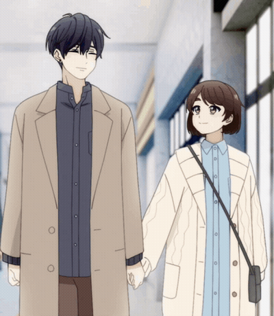 A Man And A Woman Are Holding Hands And Smiling GIF