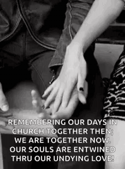 A Man And A Woman Are Holding Hands In A Black And White Photo . GIF