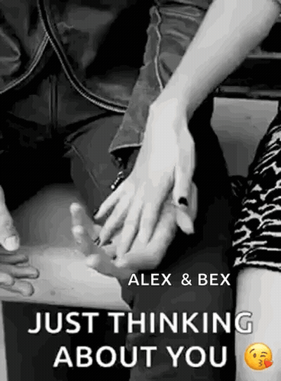 A Man And A Woman Are Holding Hands In A Black And White Photo With The Words `` Just Thinking About You '' . GIF