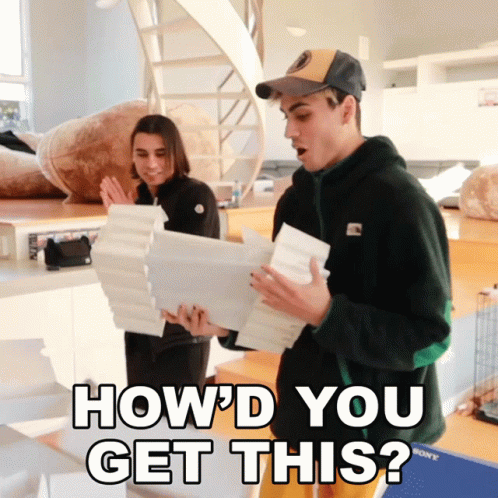 A Man And A Woman Are Holding Papers With The Words How 'D You Get This GIF