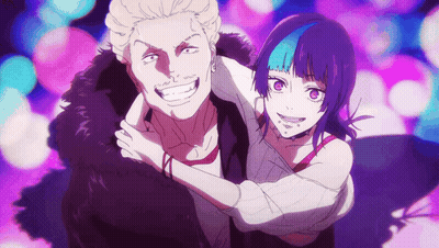 A Man And A Woman Are Hugging Each Other And Smiling For The Camera GIF