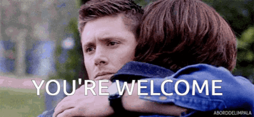 A Man And A Woman Are Hugging Each Other And The Words `` You 'Re Welcome '' Are Written On The Screen . GIF