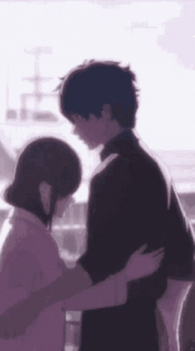 A Man And A Woman Are Hugging Each Other In A Purple Background . GIF