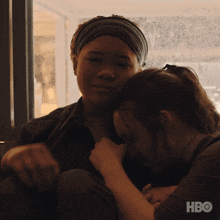 A Man And A Woman Are Hugging Each Other With Hbo Written On The Bottom GIF
