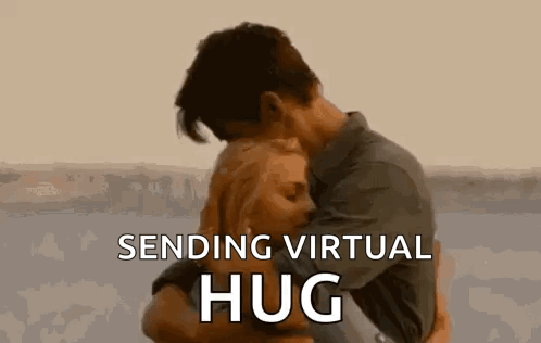 A Man And A Woman Are Hugging Each Other With The Words `` Sending Virtual Hug '' . GIF