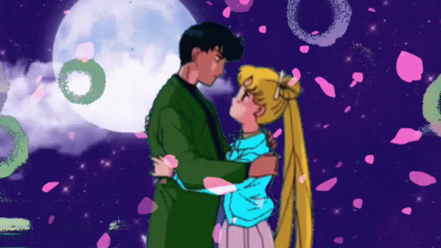 A Man And A Woman Are Hugging In Front Of A Full Moon With Petals Falling Around Them GIF