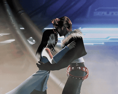 A Man And A Woman Are Hugging In Front Of A Sign That Says Scene GIF