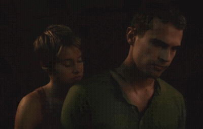 A Man And A Woman Are Hugging In The Dark GIF
