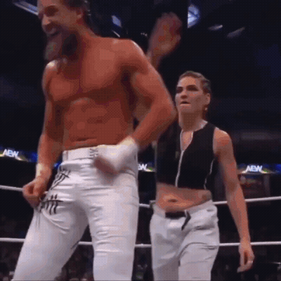 A Man And A Woman Are In A Boxing Ring . GIF