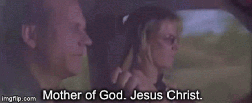 A Man And A Woman Are In A Car And The Woman Says Mother Of God Jesus Christ . GIF