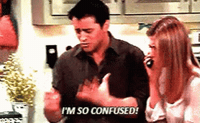 A Man And A Woman Are In A Kitchen And The Man Is Saying I 'M So Confused GIF