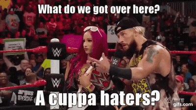 A Man And A Woman Are In A Wrestling Ring And The Woman Is Pointing At The Man GIF