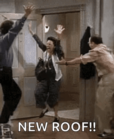 A Man And A Woman Are Jumping In The Air In A Room With The Words `` New Roof '' . GIF