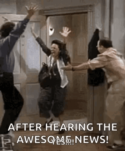 A Man And A Woman Are Jumping In The Air While A Man Holds A Woman 'S Hand . GIF