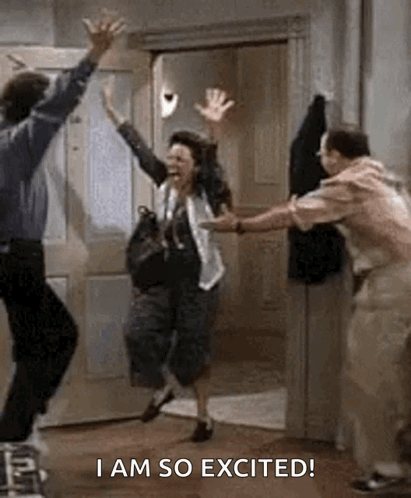 A Man And A Woman Are Jumping In The Air While A Man Holds Their Hands Up In The Air . GIF
