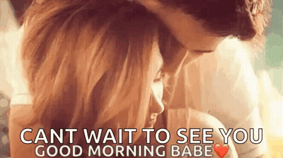 A Man And A Woman Are Kissing And Hugging Each Other . GIF