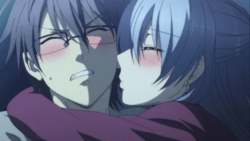 A Man And A Woman Are Kissing And The Woman Is Making A Funny Face GIF