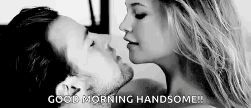 A Man And A Woman Are Kissing In A Black And White Photo And The Woman Is Saying `` Good Morning Handsome '' . GIF