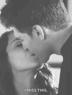 A Man And A Woman Are Kissing In A Black And White Photo And The Woman Is Saying `` I Miss This '' . GIF