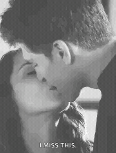 A Man And A Woman Are Kissing In A Black And White Photo And The Woman Is Saying `` I Miss This '' . GIF