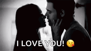 A Man And A Woman Are Kissing In A Black And White Photo With The Words `` I Love You '' . GIF