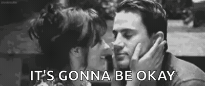 A Man And A Woman Are Kissing In A Black And White Photo . GIF