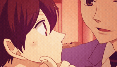 A Man And A Woman Are Kissing In A Cartoon GIF