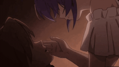 A Man And A Woman Are Kissing In A Dark Room GIF