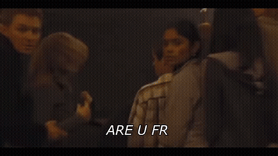 A Man And A Woman Are Kissing In A Dark Room With The Words `` Be Fucking Fr '' Written Above Them . GIF