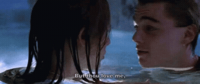 A Man And A Woman Are Kissing In A Pool . GIF