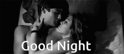 A Man And A Woman Are Kissing In Bed With The Words `` Good Night '' Written Above Them . GIF