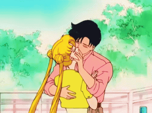 A Man And A Woman Are Kissing In Front Of A Ferris Wheel In A Cartoon . GIF