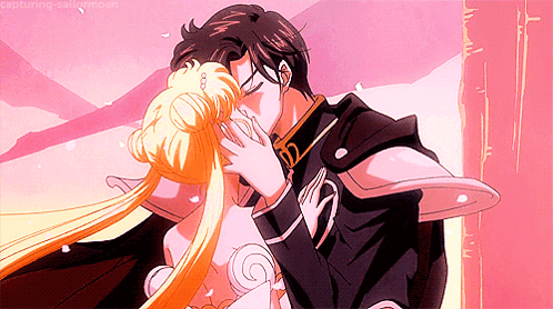 A Man And A Woman Are Kissing With The Caption Capturing Sailor Moon GIF