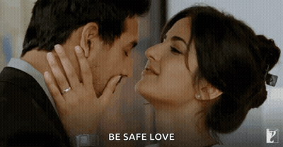 A Man And A Woman Are Kissing With The Words Be Safe Love Behind Them GIF