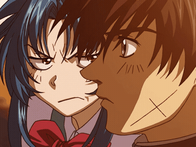 A Man And A Woman Are Looking At Each Other And The Man Has An X On His Forehead GIF