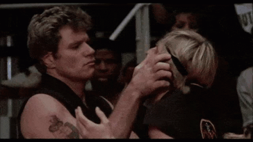 A Man And A Woman Are Looking At Each Other And The Man Is Saying `` No '' . GIF
