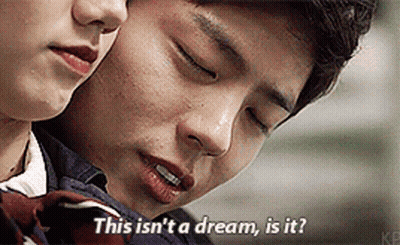A Man And A Woman Are Looking At Each Other And The Man Is Saying This Isn 'T A Dream Is It GIF