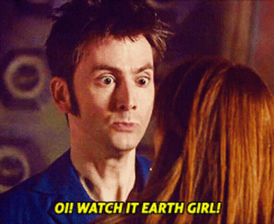 A Man And A Woman Are Looking At Each Other And The Man Says Watch It Earth Girl GIF