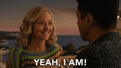 A Man And A Woman Are Looking At Each Other And The Woman Says " Yeah , I Am " GIF