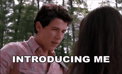 A Man And A Woman Are Looking At Each Other And The Words Introducing Me Are Above Them GIF