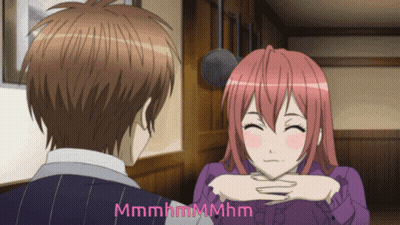 A Man And A Woman Are Looking At Each Other And The Words Mmmmhmmmhm Are Visible GIF