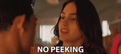 A Man And A Woman Are Looking At Each Other And The Words No Peeking Are Visible GIF
