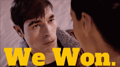 A Man And A Woman Are Looking At Each Other And The Words We Won Are Visible GIF