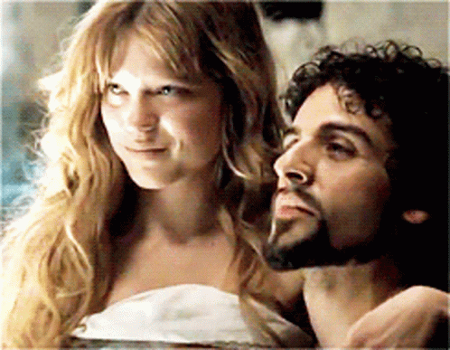 A Man And A Woman Are Looking At Each Other GIF