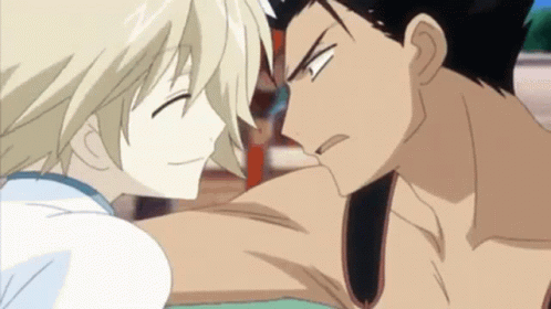 A Man And A Woman Are Looking At Each Other In A Cartoon GIF