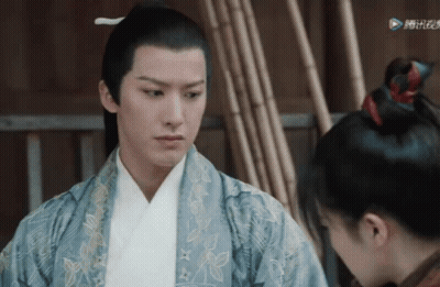 A Man And A Woman Are Looking At Each Other In A Scene From A Tv Show GIF